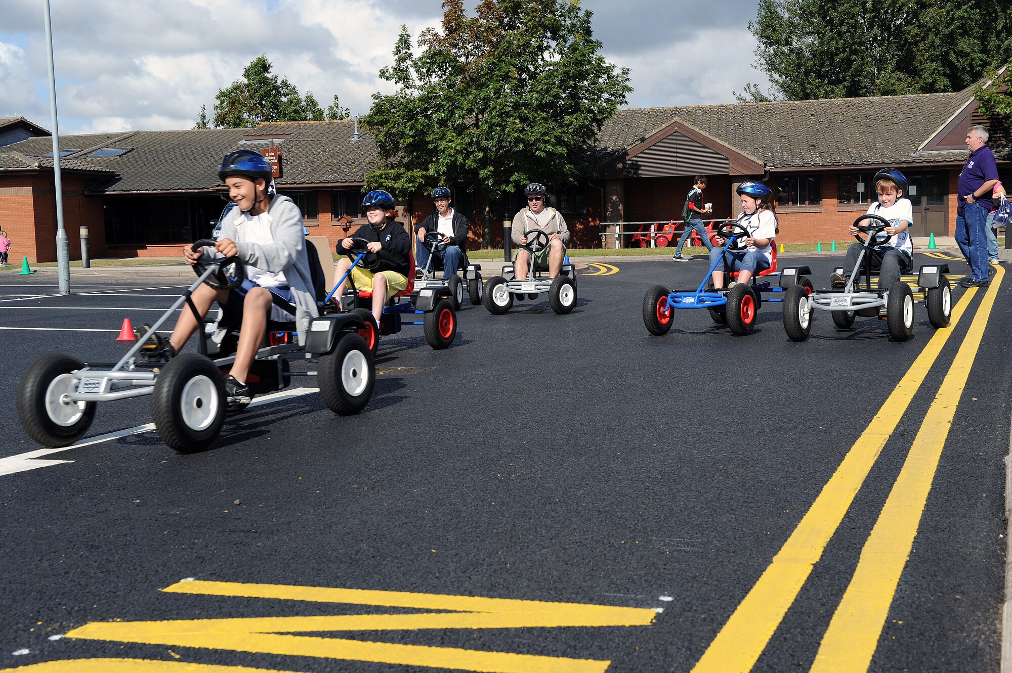 RAF MILDENHALL, England -- Children of all ages ride go-kart during the Worldwide Day of Play hosted at the RAF Mildenhall Youth Center Sept. 22, 2012. More than 900 people attended the Worldwide Day of Play which featured games, bouncy castles, Pets as Therapy dogs, go-karts and more. (U.S. Air Force photo/Tech. Sgt. Stacia Zachary)