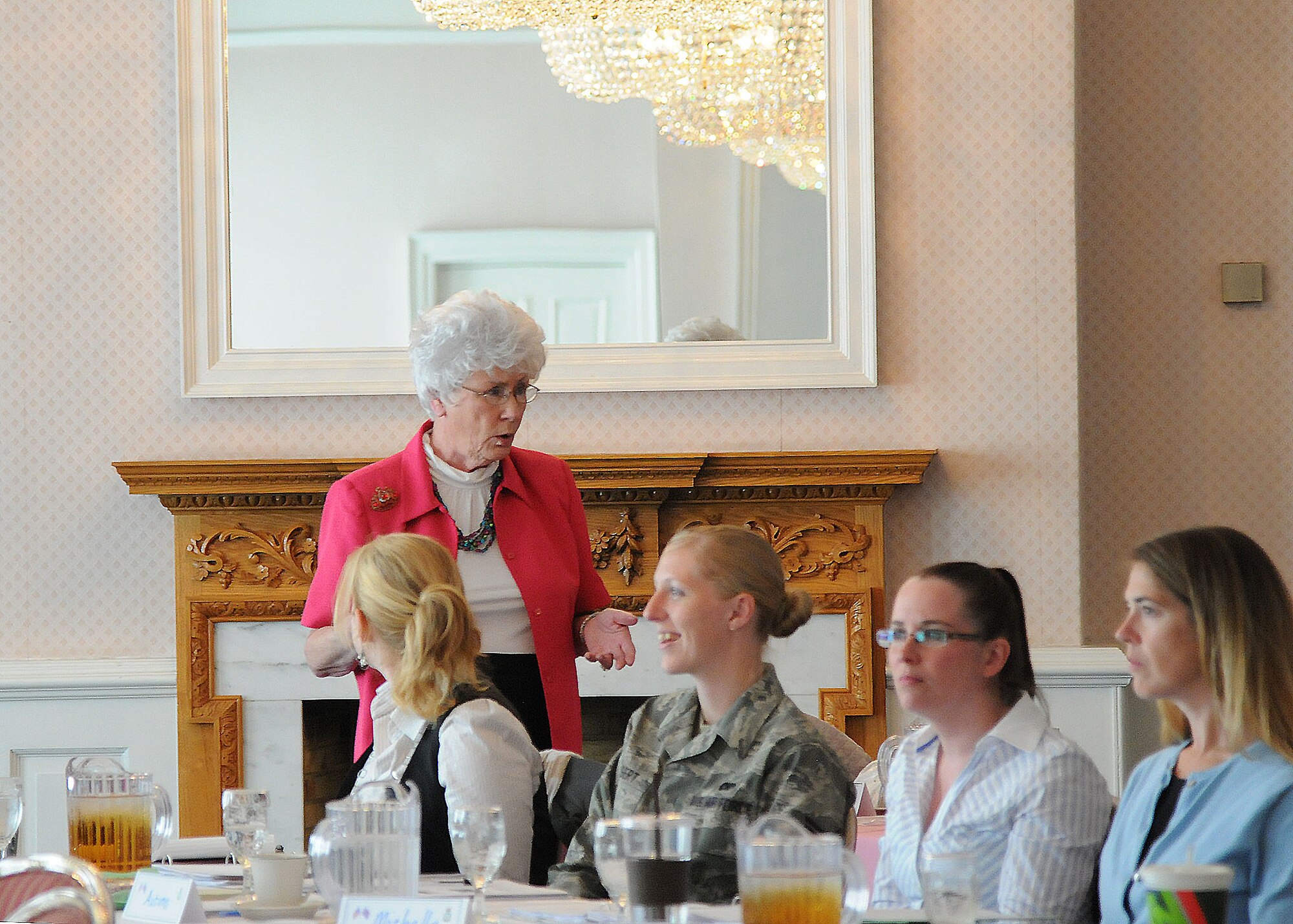RAF Mildenhall, England- Maggie Bonner, Protocol School at Maxwell AFB protocol special events lead instructor, discusses the proper order of events for a change of command ceremony during the protocol work shop at Middleton Hall, Sept. 19 2012 at RAF Mildenhall. The workshop explained the proper ways to pay respect during ceremonies such as retirements and changes of command. (U.S. Air Force photo/Airman First Class Kelsey Waters) 
