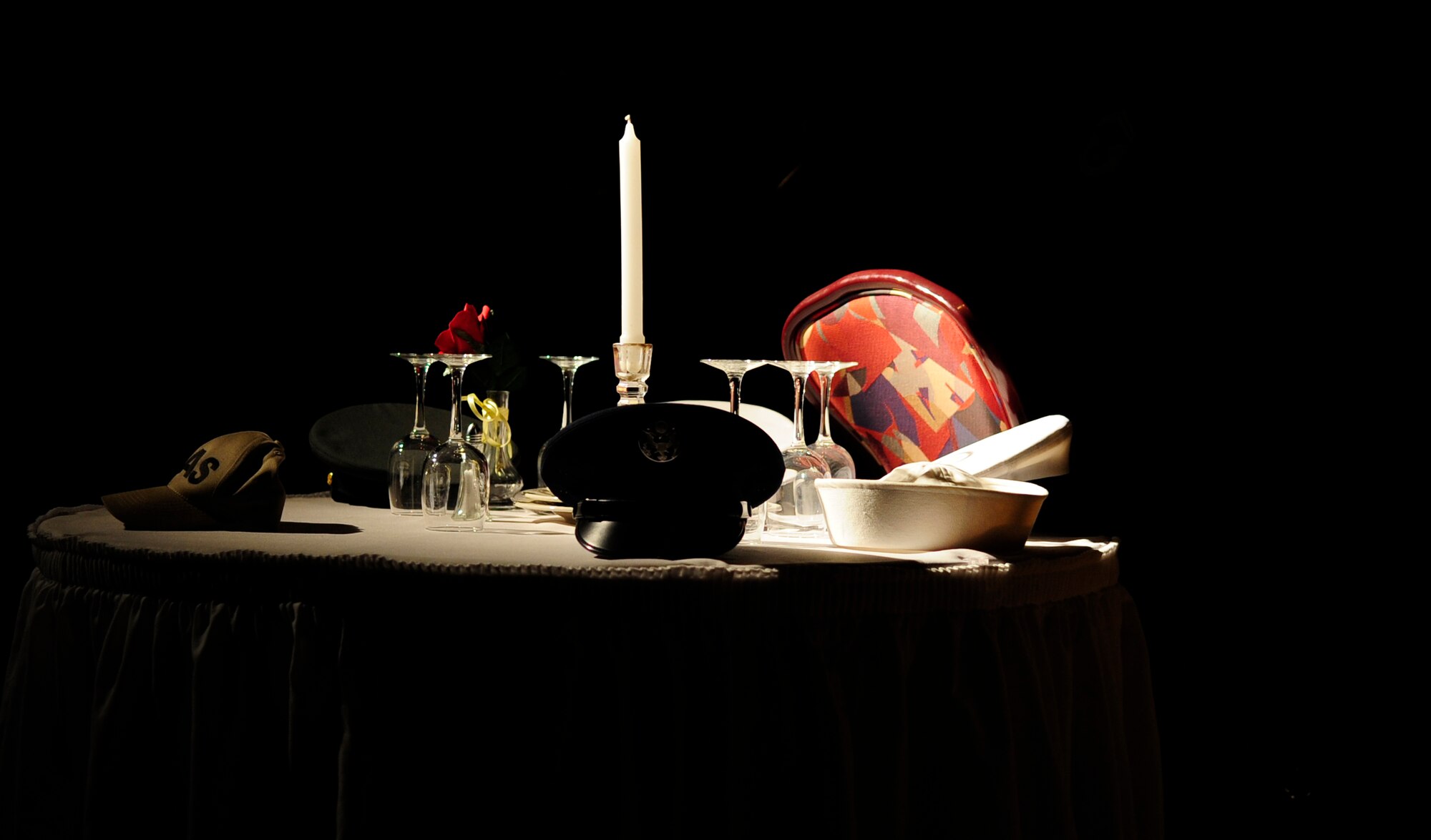 RAF MILDENHALL, England – The Prisoner of War/Missing in Action table is highlighted at the Galaxy Club during the Air Force ball Sept. 22, 2012, at RAF Mildenhall. The table was set in remembrance of the men and women of the United States who sacrificed their freedom in the defense of their country. (U.S. Air Force photo/Senior Airman Ethan Morgan)
