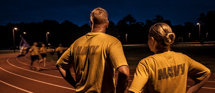 Sailors from the Naval Health Clinic Charleston wait for their turn to carry the Prisoner of War/Missing in Action flag during the POW/MIA Run Sept. 20, 2012, at Joint Base Charleston – Air Base, S.C. Different units from the joint base carried the flag for 30 minutes each from 3:30 p.m. Sept. 20 to 3:30 p.m. Sept. 21 in honor of all POWs and MIAs. (U.S. Air Force photo/Senior Airman Dennis Sloan)