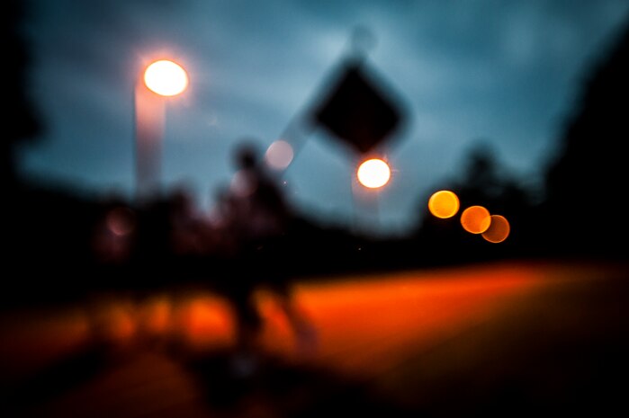 Sailors from the Naval Health Clinic Charleston carry the Prisoner of War/Missing in Action flag while during the POW/MIA Run Sept. 20, 2012, at Joint Base Charleston – Air Base, S.C. Different units from the joint base carried the flag for 30 minutes each from 3:30 p.m. Sept. 20 to 3:30 p.m. Sept. 21 in honor of all POWs and MIAs. (U.S. Air Force photo/Senior Airman Dennis Sloan)