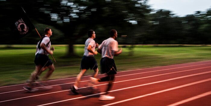 Airmen from the 628th Security Forces Squadron carry the Prisoner Of War/Missing in Action flag during the POW/MIA Run Sept. 20, 2012, at Joint Base Charleston – Air Base, S.C. Different units from the joint base carried the flag for 30 minutes each from 3:30 p.m. Sept. 20 to 3:30 p.m. Sept. 21 in honor of all POWs and MIAs. (U.S. Air Force photo/Senior Airman Dennis Sloan)