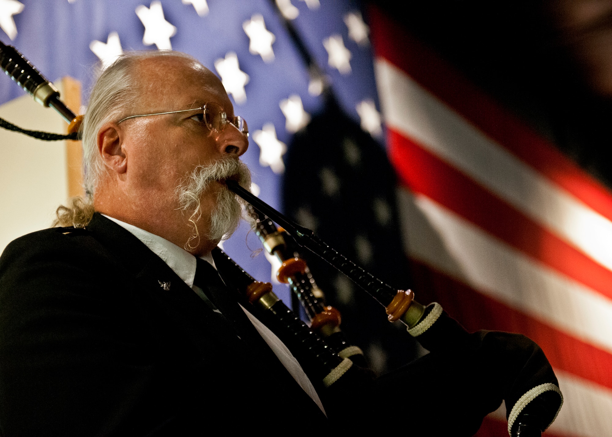 Les Matheson, a retired lieutenant colonel, plays “Amazing Grace” on the bag-pipes during the POW/MIA event Sept 21 at the Air Force Armament Museum.  The ceremony paid tribute to those military members who have yet to return home from defending America. The event was hosted by the 53rd Wing and featured guest speakers, honor guard procedures and a flyover by the 85th Test and Evaluation Squadron.  (U.S. Air Force photo/Samuel King Jr.)