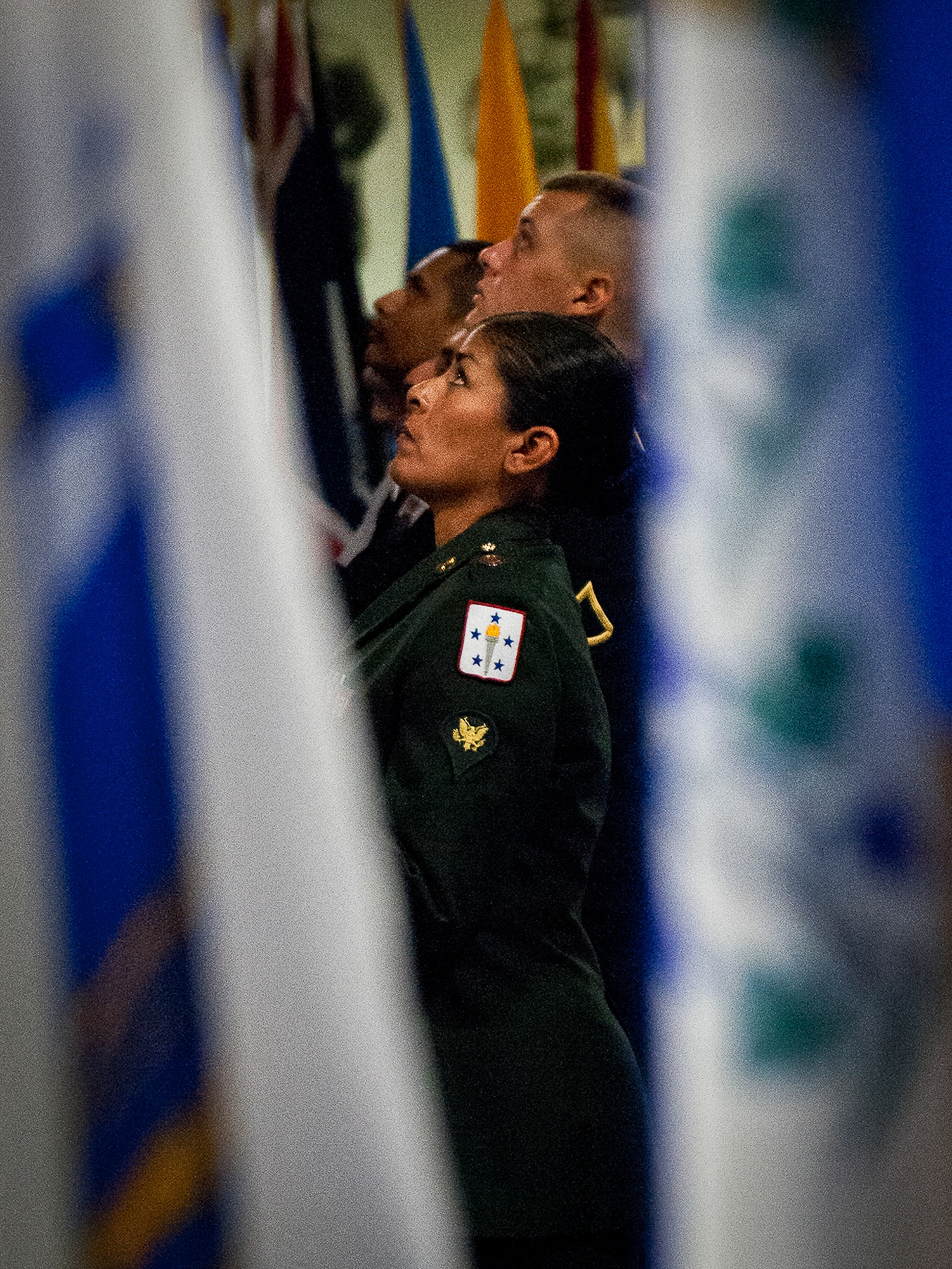 Specialist Angelia Mowery adjusts the American flag during the presentation of the colors at the 2012 Prisoner-of-War, Missing-in-Action ceremony Sept 21 at the Air Force Armament Museum.  The ceremony paid tribute to those military members who have yet to return home from defending America. The event was hosted by the 53rd Wing and featured guest speakers, honor guard procedures and a flyover by the 85th Test and Evaluation Squadron.  (U.S. Air Force photo/Samuel King Jr.)