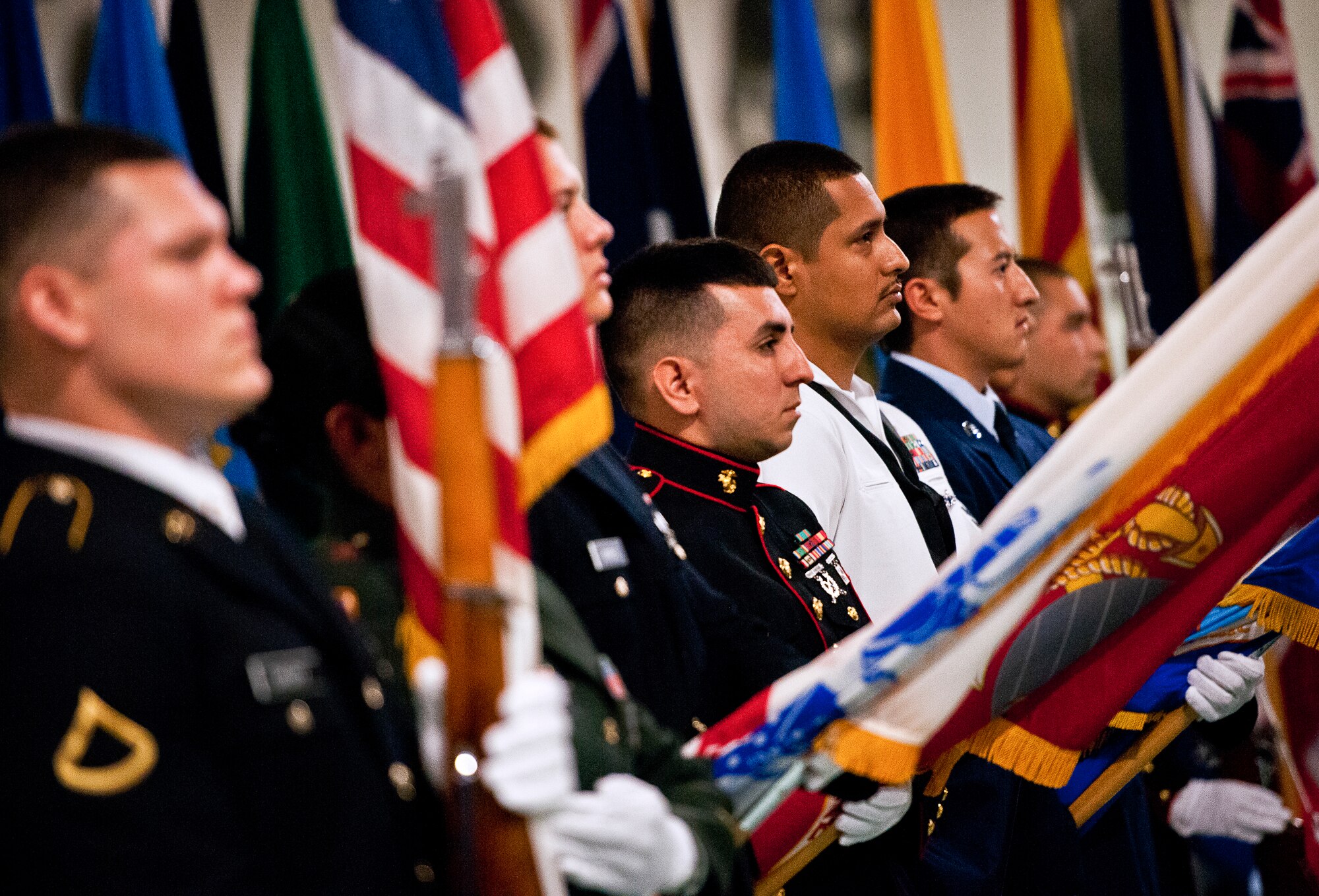 Joint service color guard members present the colors during the 2012 Prisoner-of-War, Missing-in-Action ceremony Sept 21 at the Air Force Armament Museum.  The ceremony paid tribute to those military members who have yet to return home from defending America. The event was hosted by the 53rd Wing and featured guest speakers, honor guard procedures and a flyover by the 85th Test and Evaluation Squadron.  (U.S. Air Force photo/Samuel King Jr.)