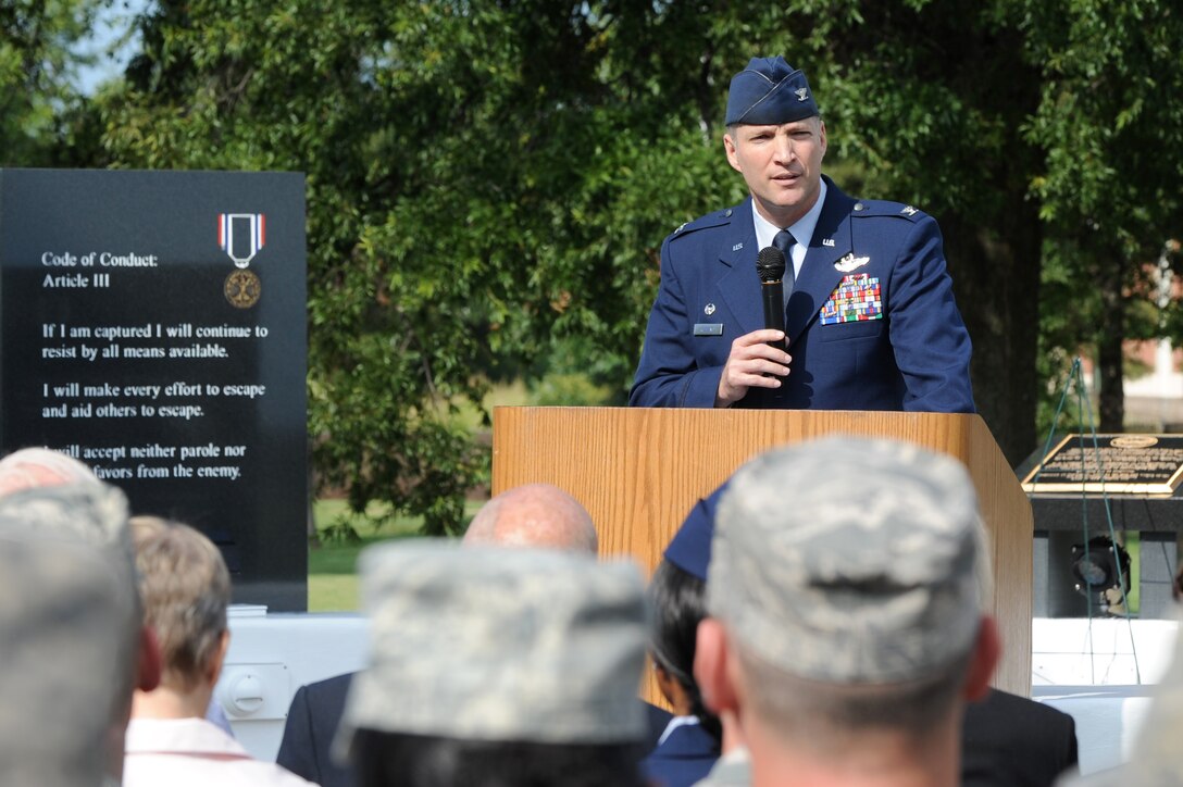 U.S. Air Force Col. Kevin Robbins, 1st Fighter Wing commander, speaks during the POW-MIA ceremony at Langley Air Force Base, Va., Sept. 21, 2012. The POW/MIA flag symbolizes never forgetting those who served their country and are still missing or imprisoned by enemy forces. (U.S. Air Force photo by Senior Airman Racheal Watson/Released)
