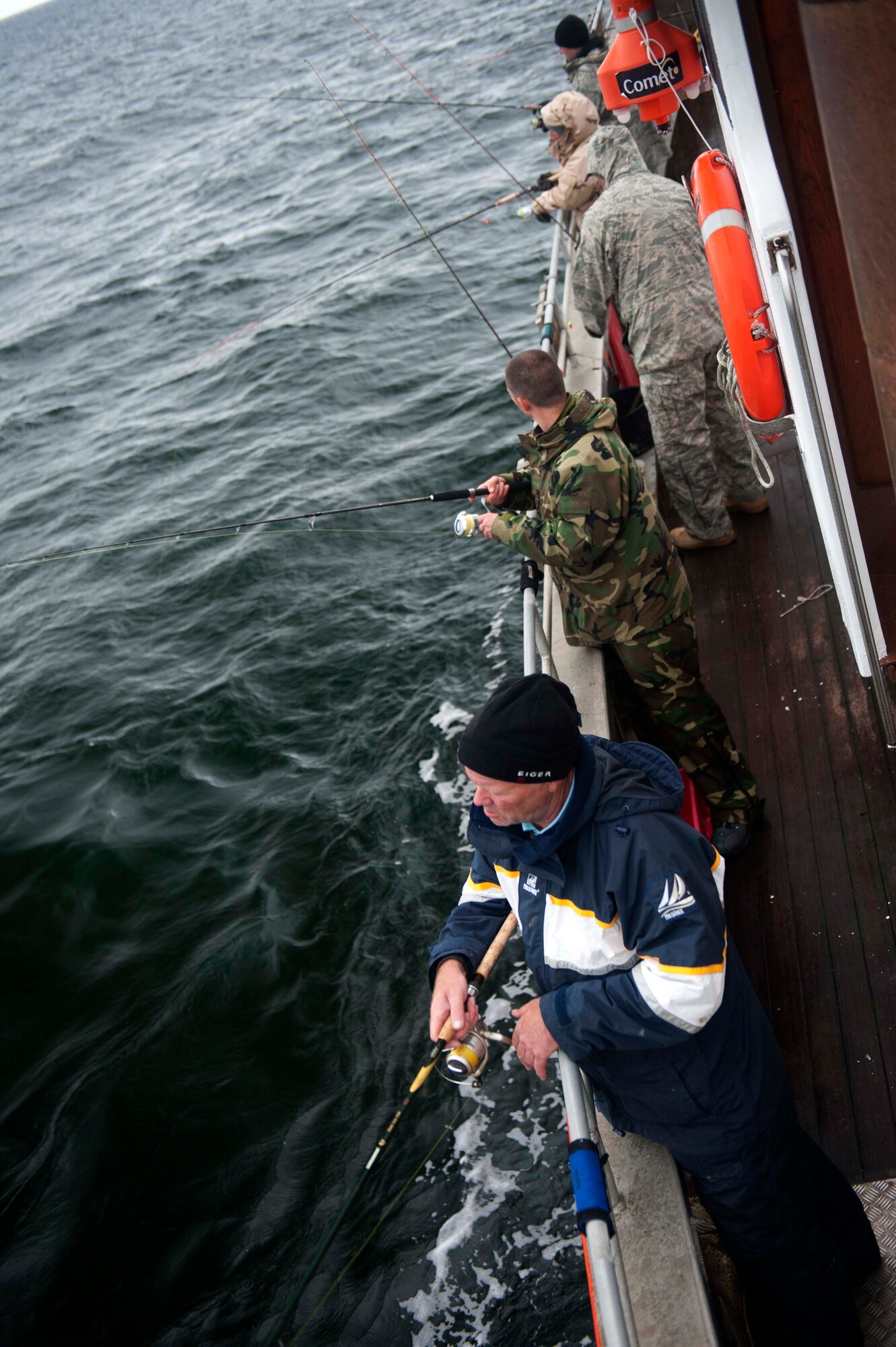 SPANGDAHLEM AIR BASE, Germany – Attendees of the 52nd Force Support Squadron Outdoor Recreation fishing trip cast their lines off the side of the Antje D. during a fishing trip near the Baltic Sea Port of Massholm Sept. 22.  Various trips across Europe are sponsored by the 52nd Force Support Squadron Outdoor Recreation and are available to all I.D. card holders and guests.  For more information, call DSN 452-7170 or 06565-61-2243. (U.S. Air Force photo by Airman 1st Class Gustavo Castillo/Released)