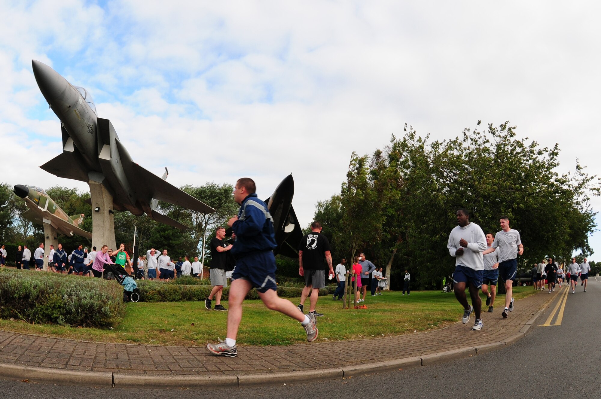 ROYAL AIR FORCE LAKENHEATH, England – Airmen and civilians from the 48th Fighter Wing race to the finish line during the POW/MIA 5k run Sept. 19, 2012. The theme of this year’s POW/MIA Remembrance week is “Never Forgotten,” referring to the hardships and sacrifices former POWs made and serving as a reminder of those who are still missing. (U.S. Air Force photo by Airman 1st Class Cory D. Payne)
