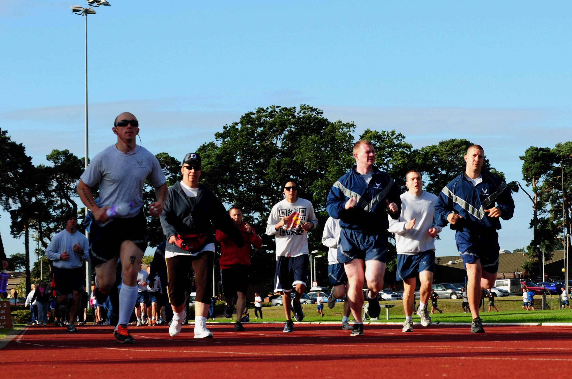ROYAL AIR FORCE LAKENHEATH, England – Airmen and civilians from the 48th Fighter Wing race to the finish line during the POW/MIA 5k run Sept. 19, 2012. The theme of this year’s POW/MIA Remembrance week is “Never Forgotten,” referring to the hardships and sacrifices former POWs made and serving as a reminder of those who are still missing. (U.S. Air Force photo by Airman 1st Class Cory D. Payne)
