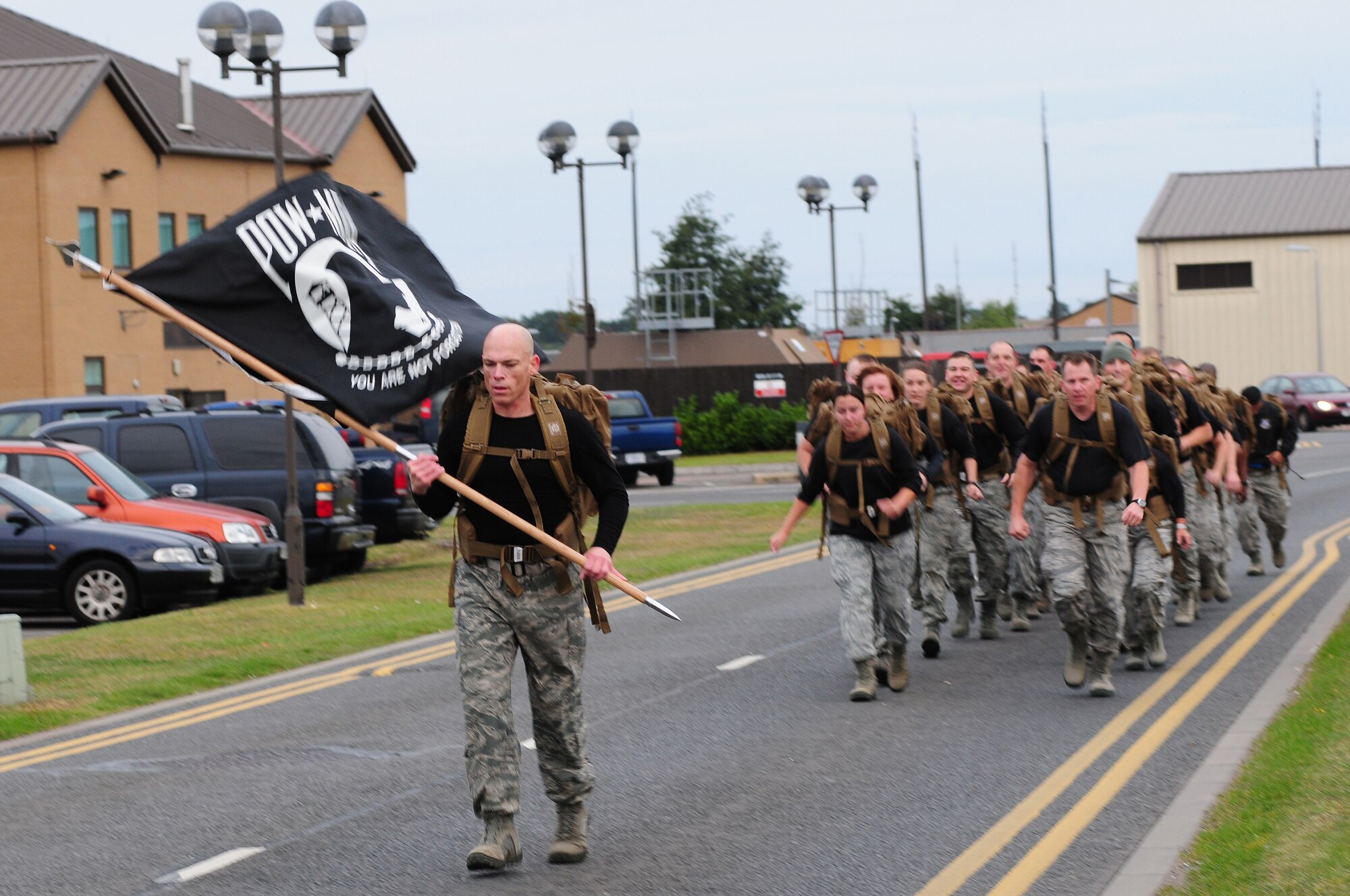 ROYAL AIR FORCE LAKENHEATH, England – Airmen from the 48th Security Forces Squadron particpates in the POW/MIA ruck march Sept. 21, 2012. The theme of this year’s POW/MIA Remembrance week is “Never Forgotten,” referring to the hardships and sacrifices former POWs made and serving as a reminder of those who are still missing. (U.S. Air Force photo by Airman 1st Class Cory D. Payne)