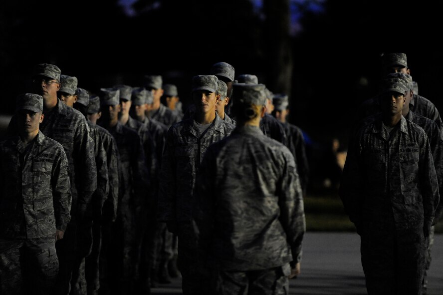 U.S. Air Force Airmen from several different units at Shaw Air Force Base stand in formation before the start of a Prisoner of War/Missing in Action flag raising ceremony, Sept. 20, 2012, Shaw Air Force Base, S.C. After the ceremony, Airmen began a 24-hour POW/MIA remembrance run. (U.S. Air Force photo by Senior Airman Kenny Holston/Released)