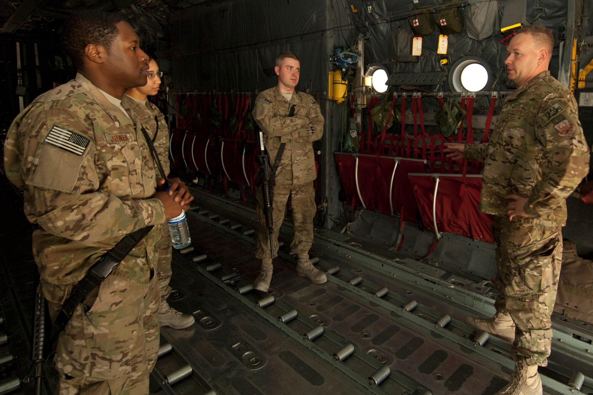 Airmen assigned to the 455th Air Expeditionary Wing listen as MSgt David Schroeder, 774th Expeditionary Airlift Squadron loadmaster, talks about his career field aboard a U.S. Air Force C-130 Hercules during the AF Enlisted Career Field Expo at Bagram Airfield, Afghanistan, Sept. 23, 2012. About a dozen booths were set up in the Combat Orientation tent at Camp Cunningham where Airmen could learn about cross-training into various chronically-critical and special duty assignments. Various airframes were also made available for Airmen to view while learning about several career fields with a flying role. (U.S. Air Force photo/SSgt Jeff Nevison