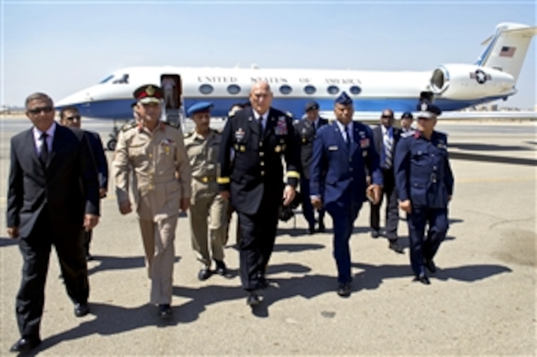U.S. Air Force Maj. Gen. Richard Clarke, center right, U.S. defense attaché in Egypt, and Egyptian army Maj. Gen. Said Abbas, second left, greet U.S. Army Chief of Staff Gen. Ray Odierno, center, upon his arrival in Cairo, Sept. 20, 2012. Odierno is in Egypt to meet with Egyptian military counterparts.