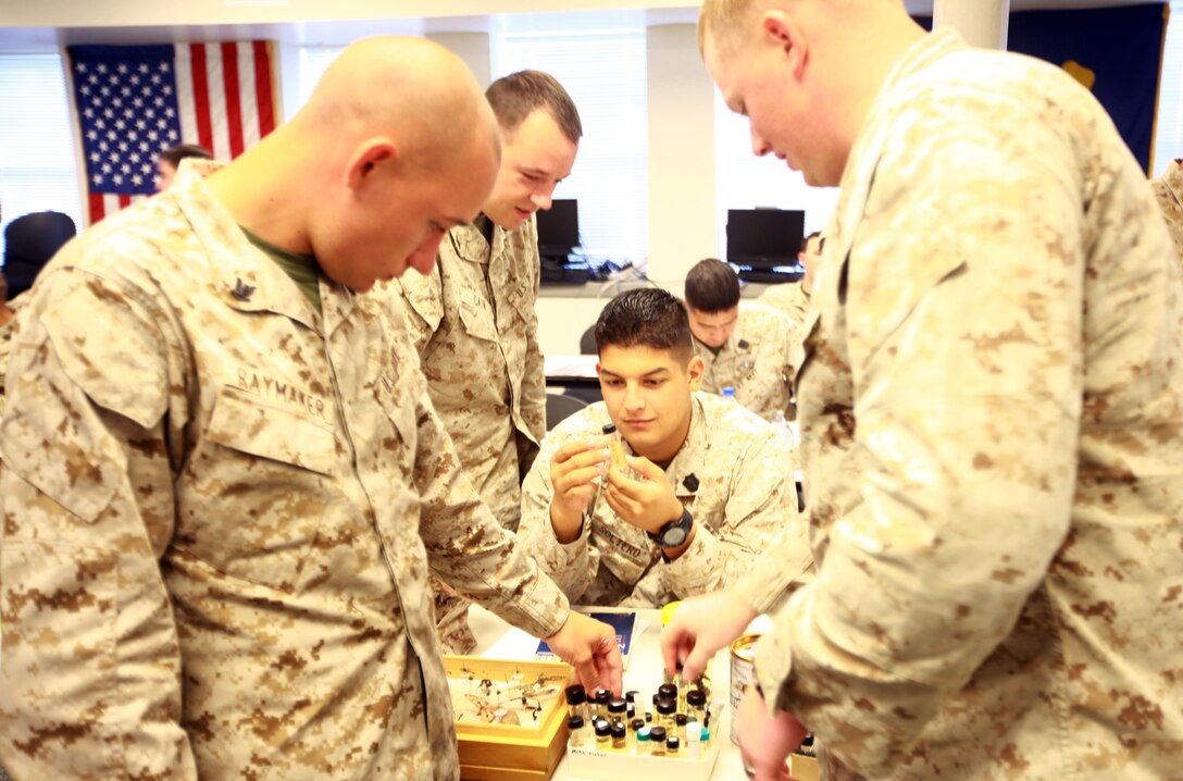 Sailors with 2nd Medical Battalion, 2nd Marine Logistics Group examine a specimen during the Preventive Medicine Petty Officers’ course aboard Camp Lejeune, N.C., Sept. 18, 2012. The duties of a preventive medicine technician include pest management, disease prevention and education, and environmental health, which covers testing the air, water and soil for contaminants. 