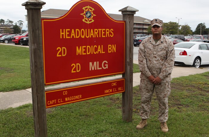 Petty Officer 1st Class Charles E. Steen, a career counselor with 2nd Medical Battalion, 2nd Marine Logistics Group, poses next to his unit’s sign aboard Camp Lejeune, N.C., Sept. 19, 2012.  Steen received the Chief Hospital Corpsman George William "Doc" Piercy award for his outstanding performance in 2011.  He is scheduled to receive the award during a ceremony at Marine Corps Base Quantico, Va., Sept. 26, 2012.