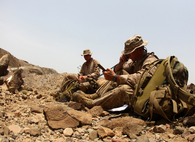 First Lt. Michael Moore, right, the platoon commander for 1st Platoon, Bravo Company, Battalion Landing Team 1st Battalion, 2nd Marine Regiment, 24th Marine Expeditionary Unit, provides a situation report, or SitRep, via radio during a force-on-force training exercise in Djibouti, Sept. 5, 2012. The exercise is part of a 24th MEU Training Force, or "T-Force" package focused on the application of infantry skills in rugged mountain terrain. The 24th MEU is deployed with the Iwo Jima Amphibious Ready Group as a theater reserve and crisis response force throughout U.S. Central Command and the Navy's 5th Fleet area of responsibility.