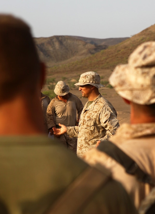 Maj. Ross Parrish, the operations officer with the 24th Marine Expeditionary Unit, speaks to Marines with 1st Platoon, Bravo Company, Battalion Landing Team 1st Battalion, 2nd Marine Regiment, 24th MEU, prior to unknown distance marksmanship training as part of a three-week training package in Djibouti, Sep. 15, 2012. The training was focused on the application of infantry skills in rugged mountain terrain. The 24th MEU is deployed with the Iwo Jima Amphibious Ready Group as a theater reserve and crisis response force throughout U.S. Central Command and the Navy's 5th Fleet area of responsibility.