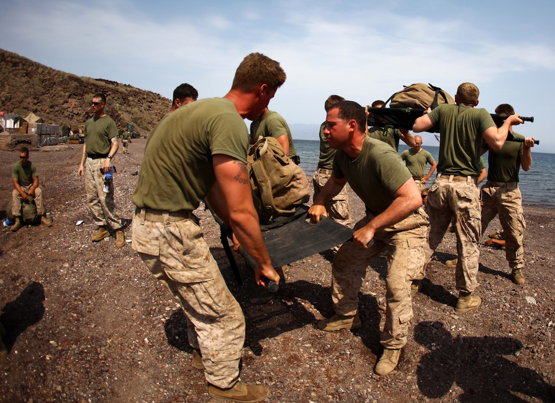 Marines with 1st Platoon, Bravo Company, Battalion Landing Team 1st Battalion, 2nd Marine Regiment, 24th Marine Expeditionary Unit, lift medical stretchers as part of a relay race while competing in the Training Force Challenge in Djibouti, Sep. 16, 2012. The competition was the culminating event of a three-week training package that was focused on the application of infantry skills in rugged mountain terrain. The 24th MEU is deployed with the Iwo Jima Amphibious Ready Group as a theater reserve and crisis response force throughout U.S. Central Command and the Navy's 5th Fleet area of responsibility.