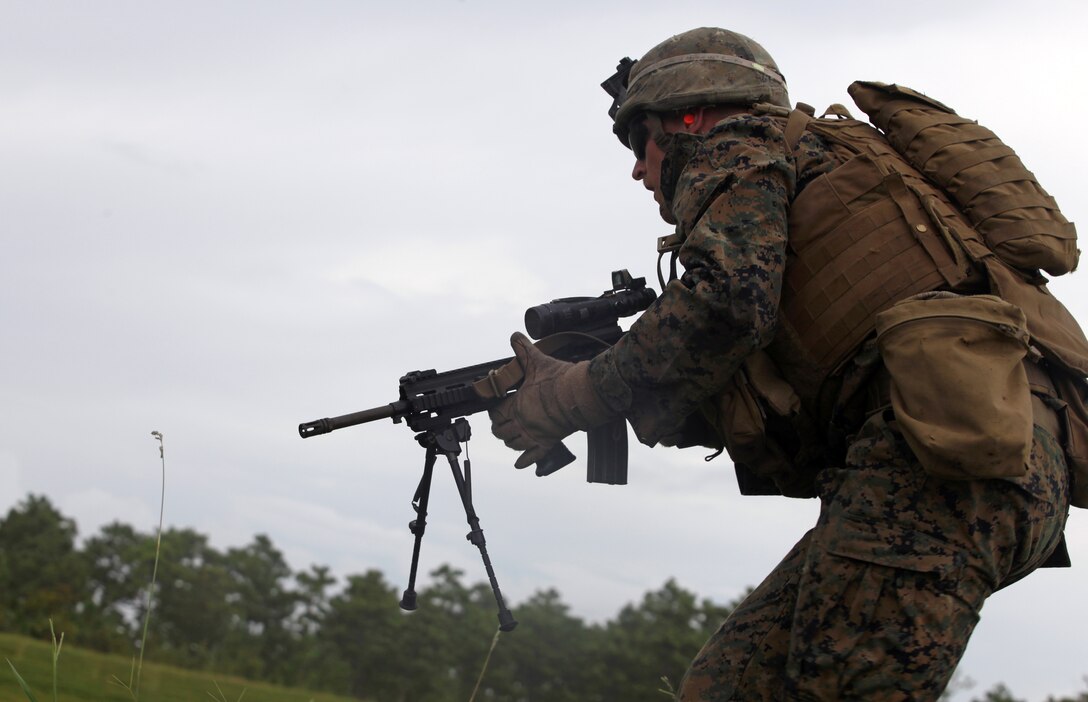 Lance Cpl. Tyler Stoneman, a fireteam leader with 1st Battalion, 6th Marine Regiment, maneuvers toward a trench during a training exercise as part of the Forge Academy Sept. 18 on base. The Forge Academy is an approximately four-week long course designed to improve the proficiency of 1/6’s fireteam leaders. Throughout the course, the students were educated on troop welfare, the psychological and physiological effects of combat, infantry tactics and the responsibilities of being a fireteam leader.