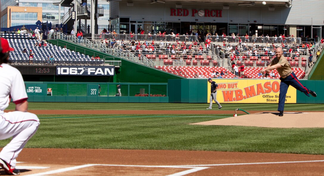 Sgt. Maj. of the Marine Corps Micheal P. Barrett throws the ceremonial first pitch at Marine Corps Day in Nationals Park Sept. 24. The event featured the Marine Corps Base Quantico Band playing the national anthem, the Marine Barracks Washington Color Guard and a heartwarming salute to wounded warriors in attendance.