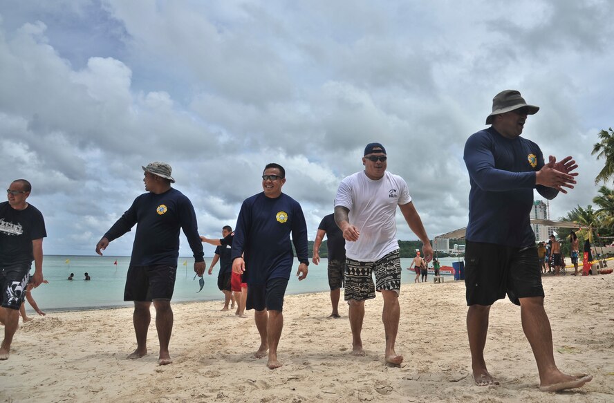 TAMUNING, Guam—Guam Police department dragon boat crew come in for a break after their second heat at the 2012 Second Annual 9/11 Commemorative Dragon Boat Race at Matapang Beach, Sept. 22. This year’s boat Race had 10 person teams including the Guam Police Department, Andersen and deployed-in Kadena AFB Fire Department Airman, Guam Fire Department, Guam National Guard, Naval Fire Department, Navy Tag Five and the Haggan Outrigger Canoe Club. The dragon boat race consisted of eight separate heats competing for time, with the Guam Police Department taking the overall win with 2:12.63 seconds. (U.S. Air Force photo by Staff Sgt. Alexandre Montes/Released)