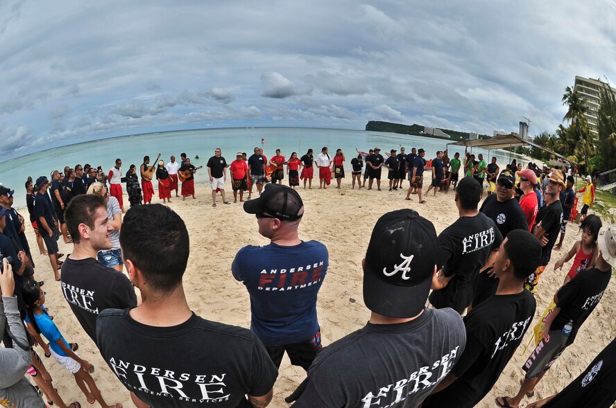 TAMUNING, Guam--The Pa’a Tao Tao, a non-profit cultural organization on Guam, gives the opening blessings during the 2012 Second Annual 9/11 Commemorative Dragon Boat Race at Matapang Beach, Sept. 22. This year’s boat Race had 10 person teams including the Guam Police Department, Andersen and deployed-in Kadena AFB Fire Department Airman, Guam Fire Department, Guam National Guard, Naval Fire Department, Navy Tag Five and the Haggan Outrigger Canoe Club. The dragon boat race consisted of eight separate heats competing for time, with the Guam Police Department taking the overall win with 2:12.63 seconds. (U.S. Air Force photo by Staff Sgt. Alexandre Montes/Released)