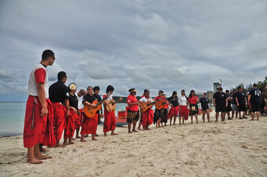 TAMUNING, Guam--The Pa’a Tao Tao, a non-profit cultural organization on Guam, gives the opening blessings during the 2012 Second Annual 9/11 Commemorative Dragon Boat Race at Matapang Beach here, Sept. 22. This year’s boat race had ten-person teams that included personnel from the Guam Police Department, Andersen Air Force Base, deployed-in Kadena AFB Fire department, Guam Fire Department, Guam National Guard, Naval Fire Department, Navy Tag Five and the Haggan Outrigger Canoe Club. The dragon boat race consisted of eight separate heats, competing for time. The Guam Police Department took the overall win with 2:12.63 seconds. (U.S. Air Force photo by Staff Sgt. Alexandre Montes/Released)