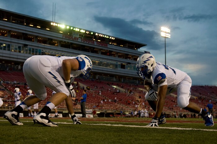 U.S. Air Force Academy Falcons football players practice before their game against the University of Nevada, Las Vegas Rebels Sept. 22, 2012, at Sam Boyd Stadium in Las Vegas, Nev. The pre-game practice ensures players are warmed up and ready for the game. (U.S. Air Force photo by Senior Airman Daniel Hughes)