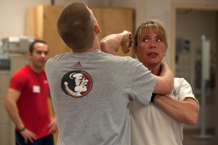 Kathy Wright, Rape Aggression Defense Systems of Self Defense director of women's programs, teaches Airmen defensive techniques during a R.A.D. Systems class Sept. 18, 2012, at Nellis Air Force Base, Nev. This is the second time the R.A.D. Systems of Self Defense has offered this training at Nellis AFB.  (U.S. Air Force photo by Staff Sgt. Christopher Hubenthal)

