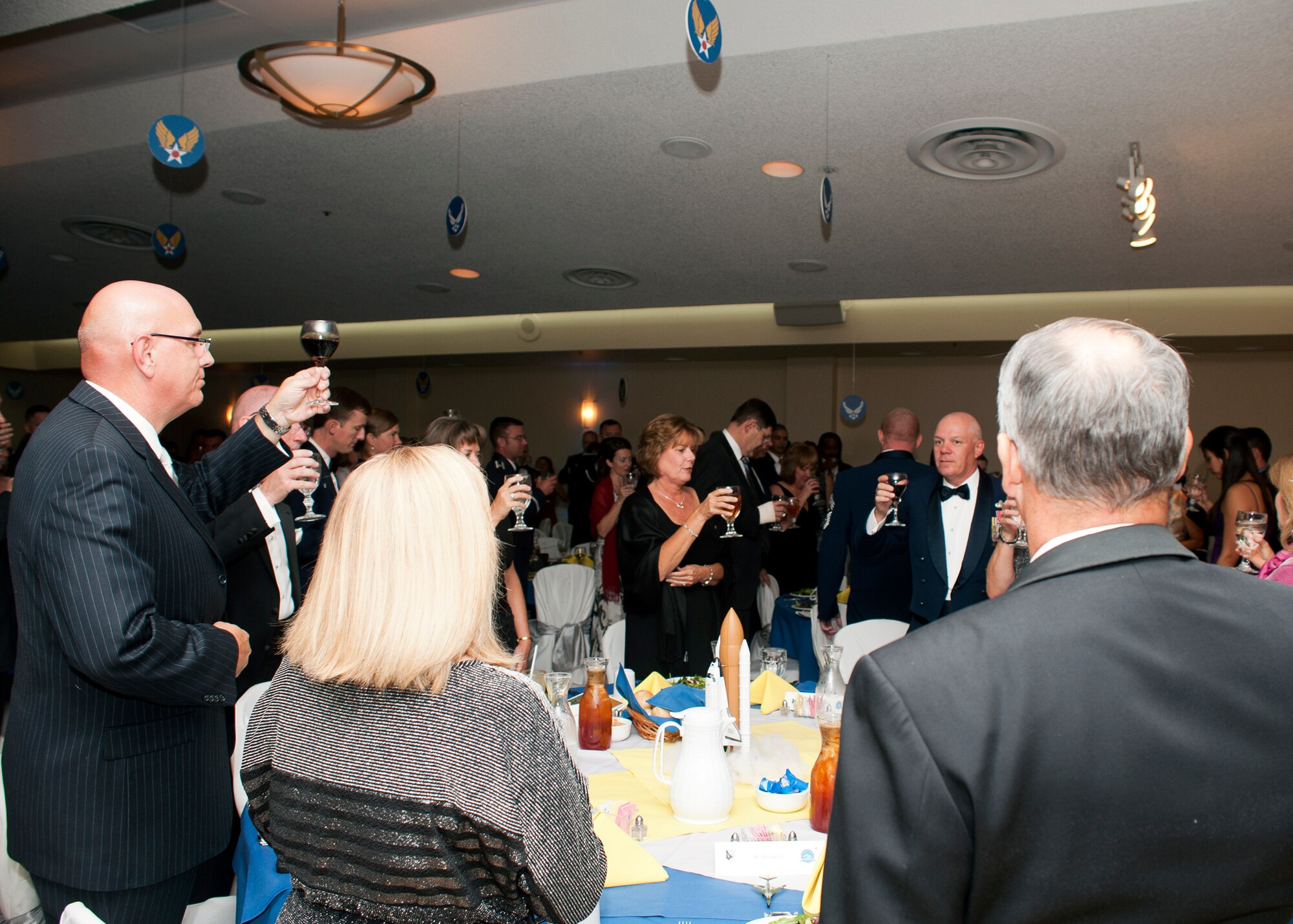Team Edwards members stand for toasts made during the Air Force Ball at Edwards Sept. 21 at Club Muroc. (U.S. Air Force photo by Ethan Wagner)