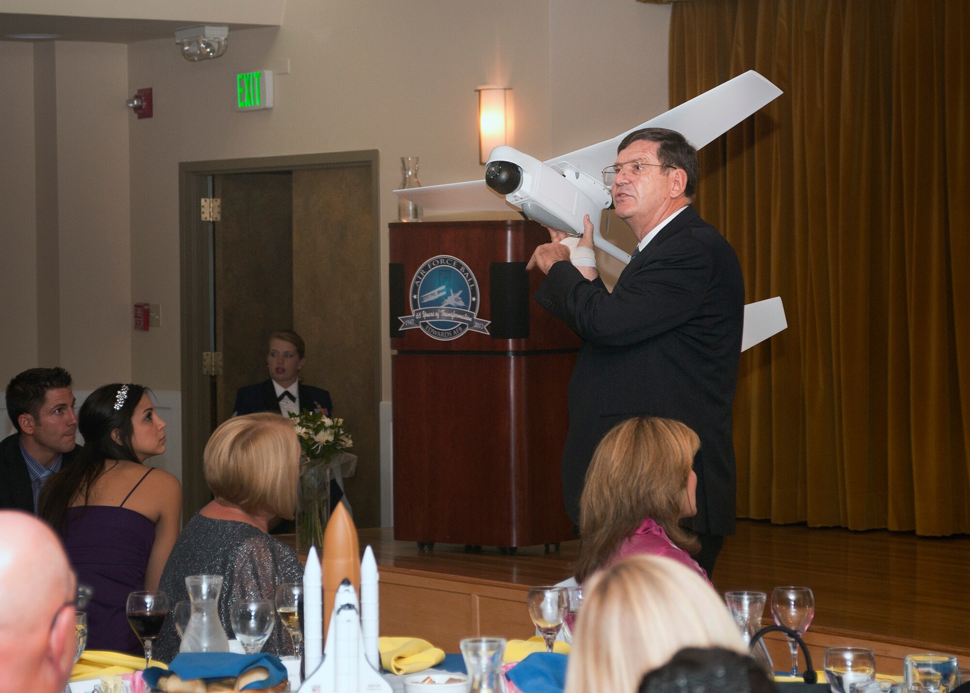 Retired Air Force colonel and test pilot Ted Wierzbanowski, AeroVironment UAS Airspace Integration director, served as the keynote speaker and spoke about the changes over the years in the Air Force.  Here, he holds an unmanned aerial system that can be launched by hand.  (U.S. Air Force photo by Ethan Wagner)