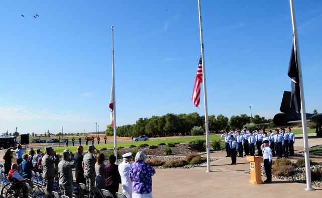 Veterans and Members of Team Beale salute as U.S. Air Force T-38 Talon jet trainers perform a fly-by during a POW/MIA ceremony at Heritage Park, Beale Air Force Base, Calif., Sept. 21, 2012. The third Friday in September was chosen to honor those who were prisoners of war and those who are still missing in action. (U.S. Air Force photo by Senior Airman Allen Pollard/Released)