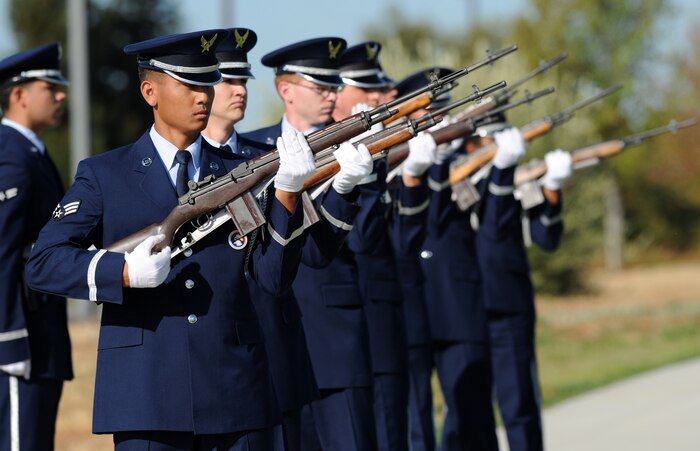Members of Team Beale’s Honor Guard perform a three-shot volley during a POW/MIA ceremony at Heritage Park, Beale Air Force Base, Calif., Sept. 21, 2012. The third Friday in September was chosen to honor servicemembers who were prisoners of war and those who are still missing in action. (U.S. Air Force photo by Staff Sgt. Robert M. Trujillo/Released)