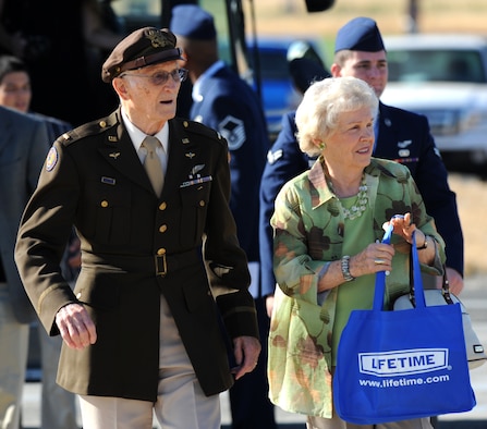 Leonard Kovar and his wife Lorraine are escorted by Airmen to a POW/MIA ceremony at Heritage Park, Beale Air Force Base, Calif., Sept. 21, 2012. Kovar, a POW in 1944 during WWII was the event’s guest speaker. (U.S. Air Force photo by Staff Sgt. Robert M. Trujillo/Released)