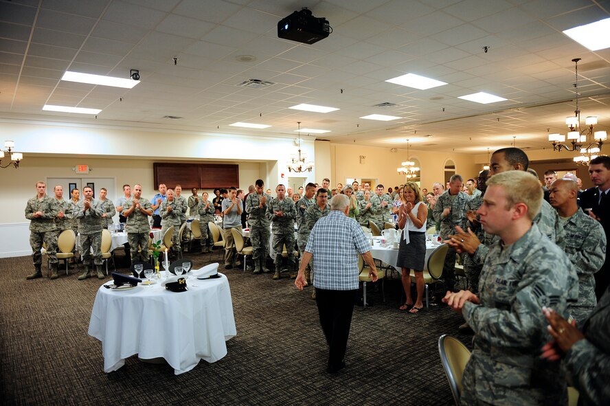 Attendants of the prisoner of war and missing in action breakfast give guest speaker, and former prisoner of war retired Senior Master Sgt. Kenneth Duffy a standing ovation after he finished speaking, Shaw Air Force Base, S.C., Sept. 20, 2012. Duffy retired from the military in 1967, but still remains active in the military community. (U.S. Air Force photo by Airman 1st Class Daniel Blackwell/Released)