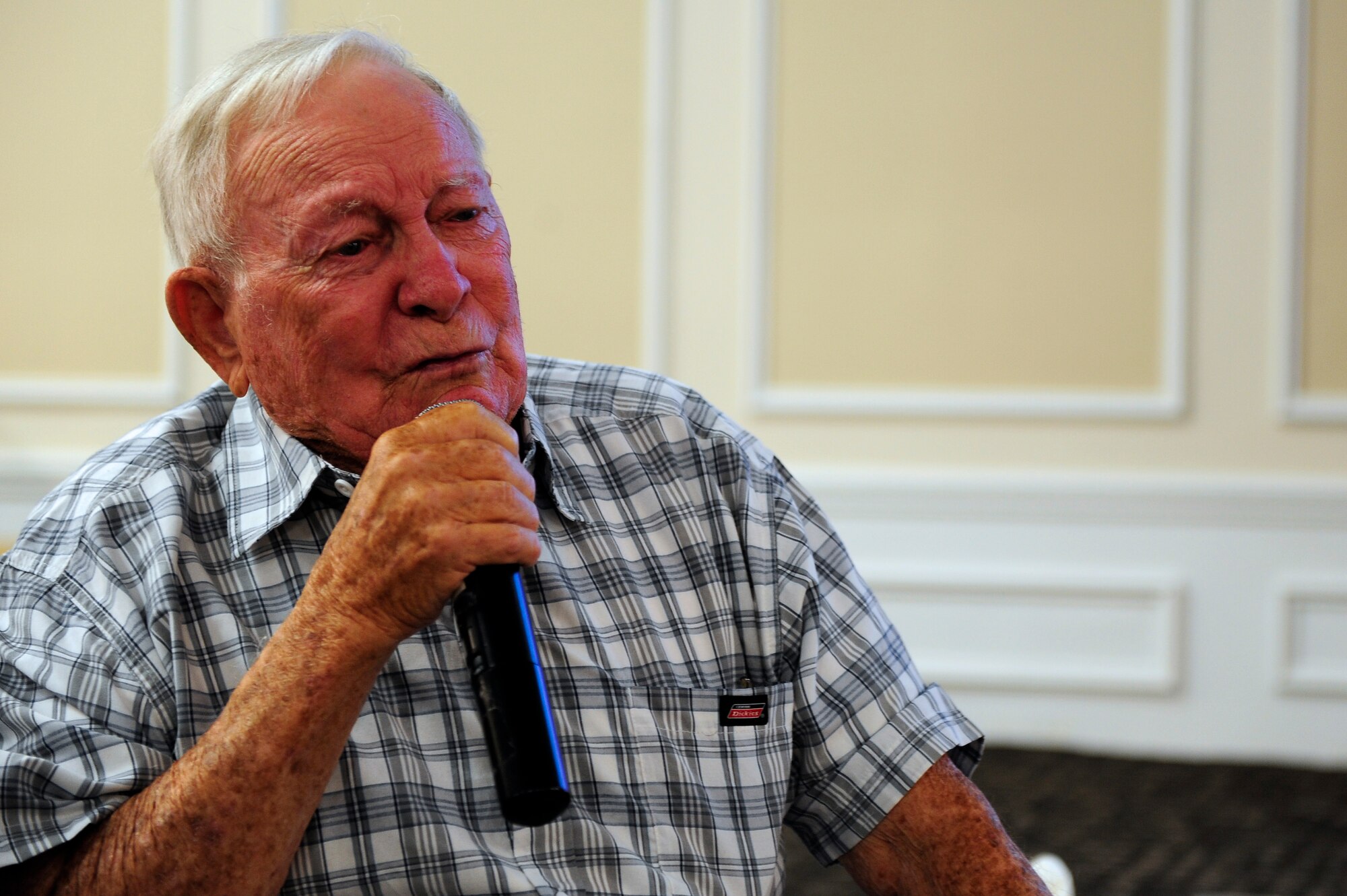 Guest speaker, and former prisoner of war Senior Master Sgt. (retired) Kenneth Duffy fights back tears as he recalls Adolf Hitler’s order to execute the prisoners of war, Shaw Air Force Base, S.C., Sept. 20, 2012. Many times throughout his recount Duffy fought to keep from crying when speaking about the struggles he and his Wingman faced during imprisonment. (U.S. Air Force photo by Airman 1st Class Daniel Blackwell/Released)
