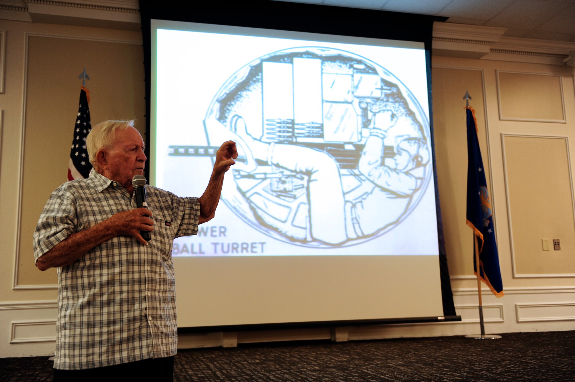 Guest speaker, and former prisoner of war retired Senior Master Sgt. Kenneth Duffy, speaks at a POW/MIA breakfast, Shaw Air Force Base, S.C., Sept. 20, 2012. Duffy explains his experience operating the ball turret of a B-24 Liberator during World War II. (U.S. Air Force photo by Airman 1st Class Daniel Blackwell/Released)