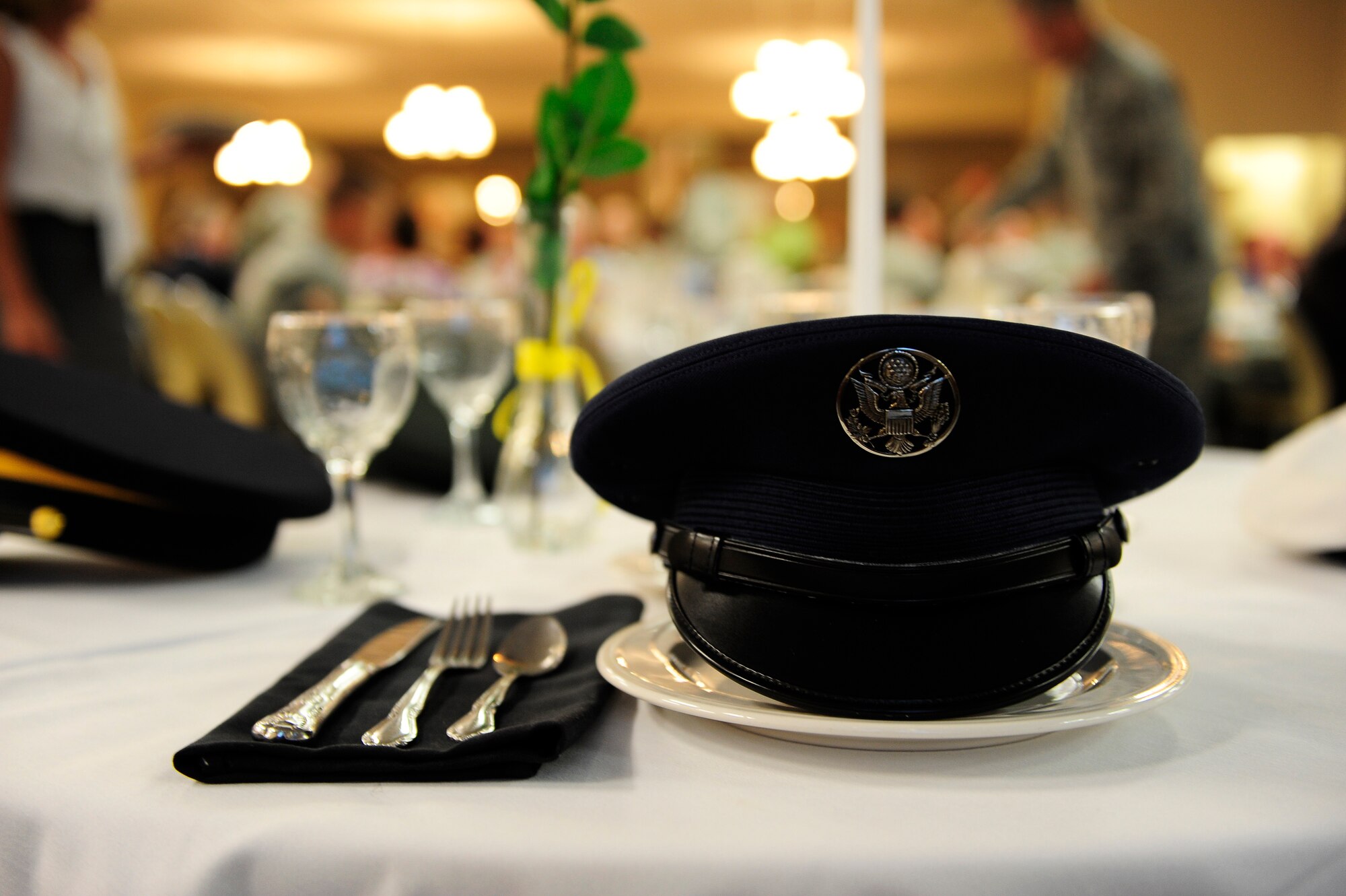 Air Force, Army, Marine Corp, Navy and Coast Guard covers adorn the commemorative, stand-alone table  at a prisoner of war and missing in action remembrance breakfast, Shaw Air Force Base, S.C., Sept. 20, 2012. The Air Force cover at the table represents all Air Force members who are or have been prisoners of war or missing in action and each service’s respective cover symbolizes the same. (U.S. Air Force photo by Airman 1st Class Daniel Blackwell/Released)
