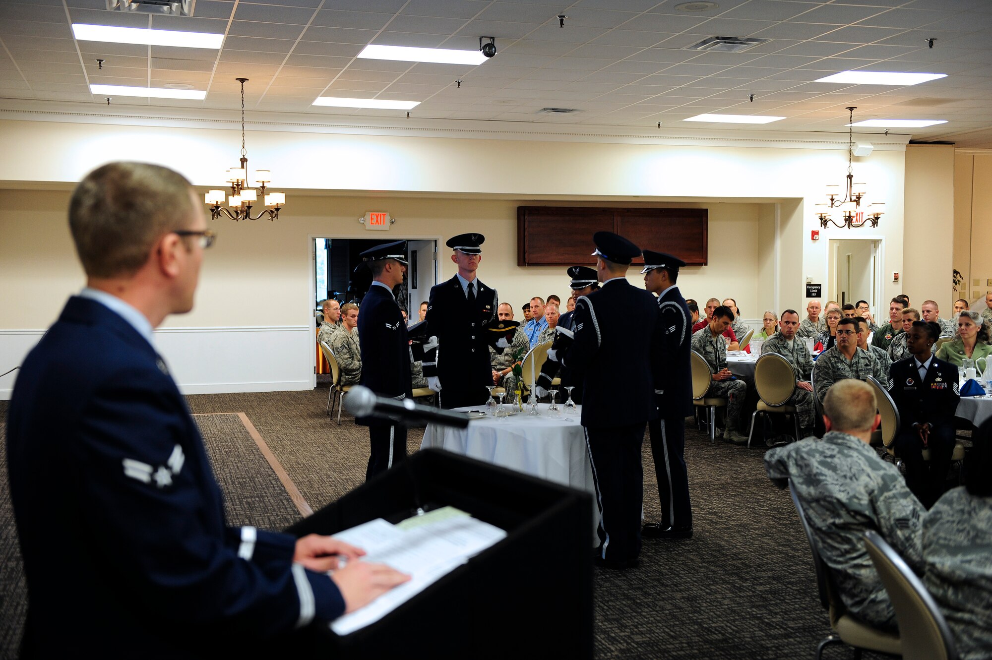 A prisoner of war and missing in action commemorative breakfast was held at Shaw Air Force Base, S.C., Sept. 20, 2012. The five members of the 20th Force Support Squadron Honor Guard represent the five branches of service (Air Force, Army, Marine Corps, Navy and Coast Guard). The white tablecloth signifies the purity of their intentions to their country. The rose symbolizes those who gave their lives. The yellow ribbon stands for the unyielding demand for proper account of the missing. The lemon symbolizes the bitter fate of those not with us. The salt on the plate represents the tears of family and loved ones who keep the faith as they wait. The glasses on the table are inverted in remembrance of those who are with us in spirit. The table is set apart from the others for those who fought in defense of our country. The candle is lit to show vigilance for those still missing. (U.S. Air Force photo by Airman 1st Class Daniel Blackwell/Released)