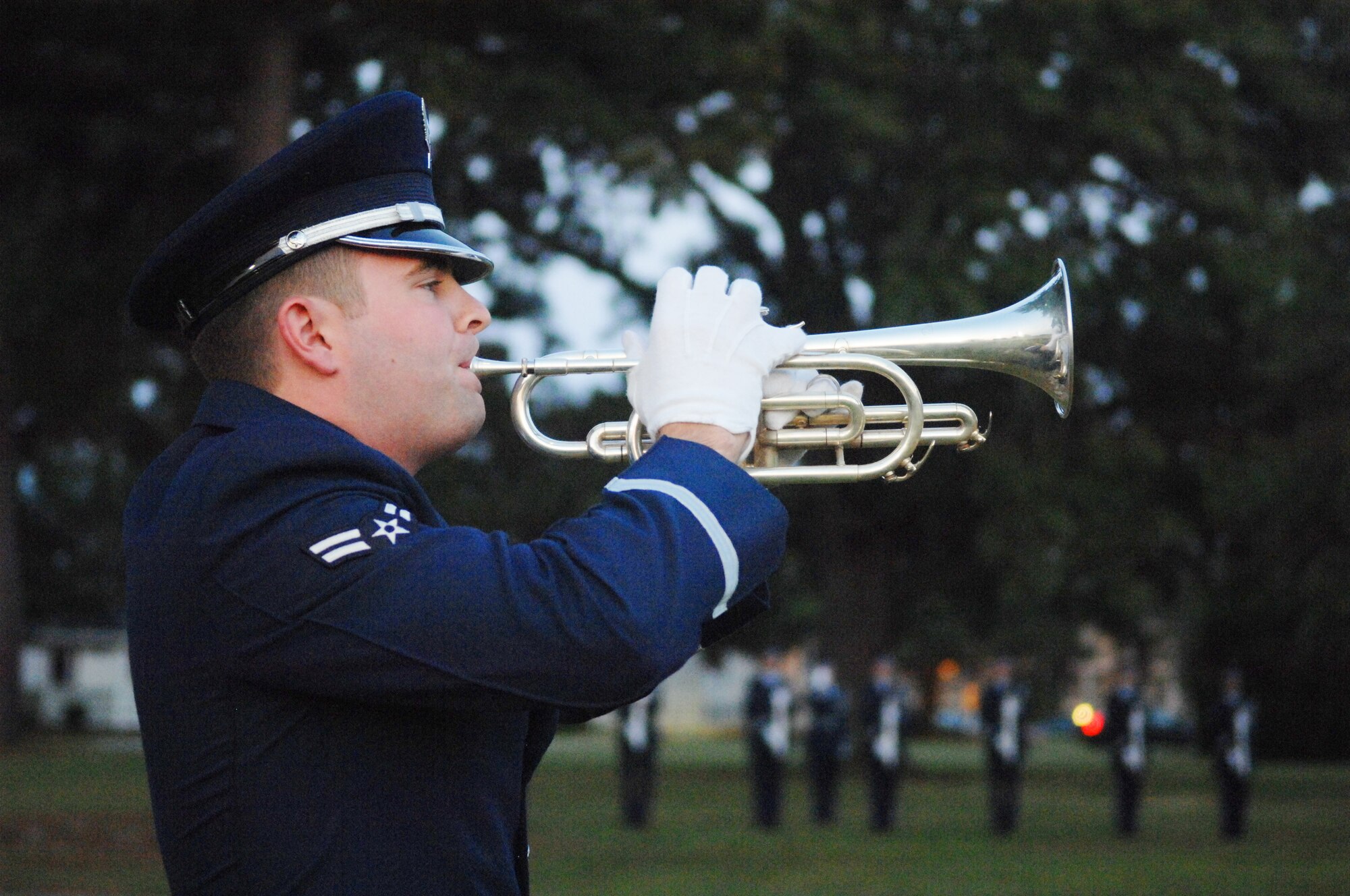 U.S. Air Force Airman 1st Class Trevor Reiss, Shaw Air Force Base honor gaurd member plays taps at the closing ceremony for the prisoner of war and missing in action recognition day at Shaw Air Force Base, S.C., Sept. 21, 2012.  On the third Friday of September, the POW/MIA flag is flown to honor those lost at war.  The vigil signifies the perseverance of the United States in the search for POWs and MIA.(U.S. Air Force photo by Airman Nicole Sikorski/Released)