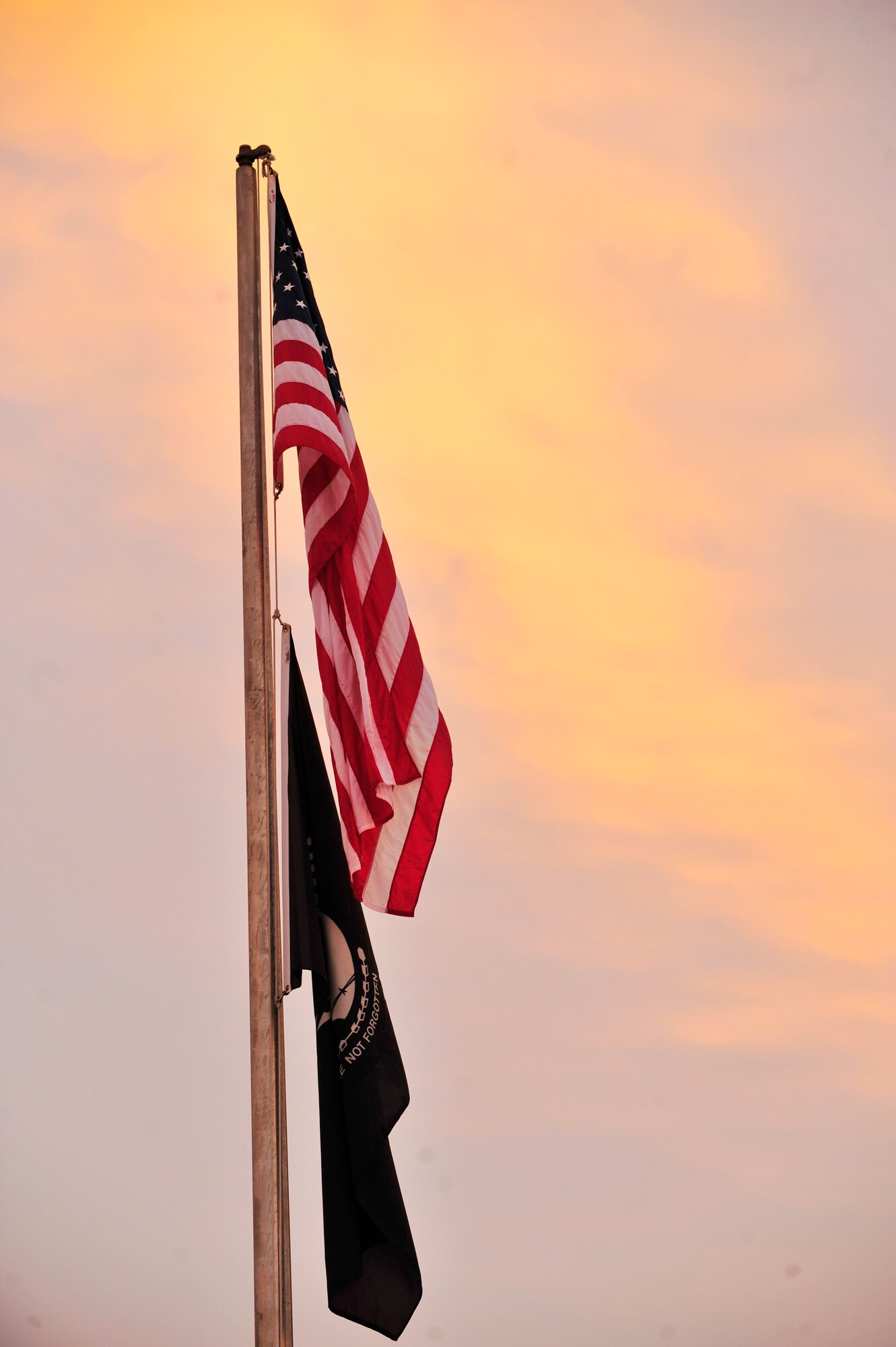 The prisoner of war and missing in action flag is flown underneath the American flag during the National POW/MIA Recognition Day at Shaw Air Force Base, S.C., Sept. 20, 2012. The POW/MIA flag has been flown on the third Friday in September every year since 1979, when the United States Congress passed a bill calling for the remembrance of those who made the ultimate sacrifice. (U.S. Air Force photo by Airman Nicole Sikorski/Released)