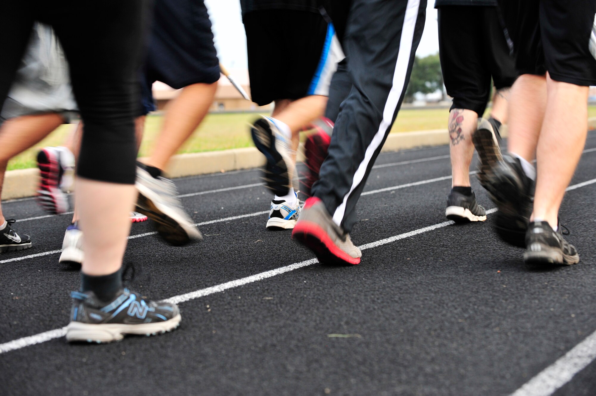 U.S. Air Force Airmen from the 20th Force Support Squadron run for the prisoner of war and missing in action recognition day at Shaw Air Force Base, S.C., Sept. 20, 2012.  On the third Friday of September, the POW/MIA flag is flown to honor those lost at war.  The vigil signifies the perseverance of the United States in the search for POWs and MIA. (U.S. Air Force photo by Airman Nicole Sikorski/Released)