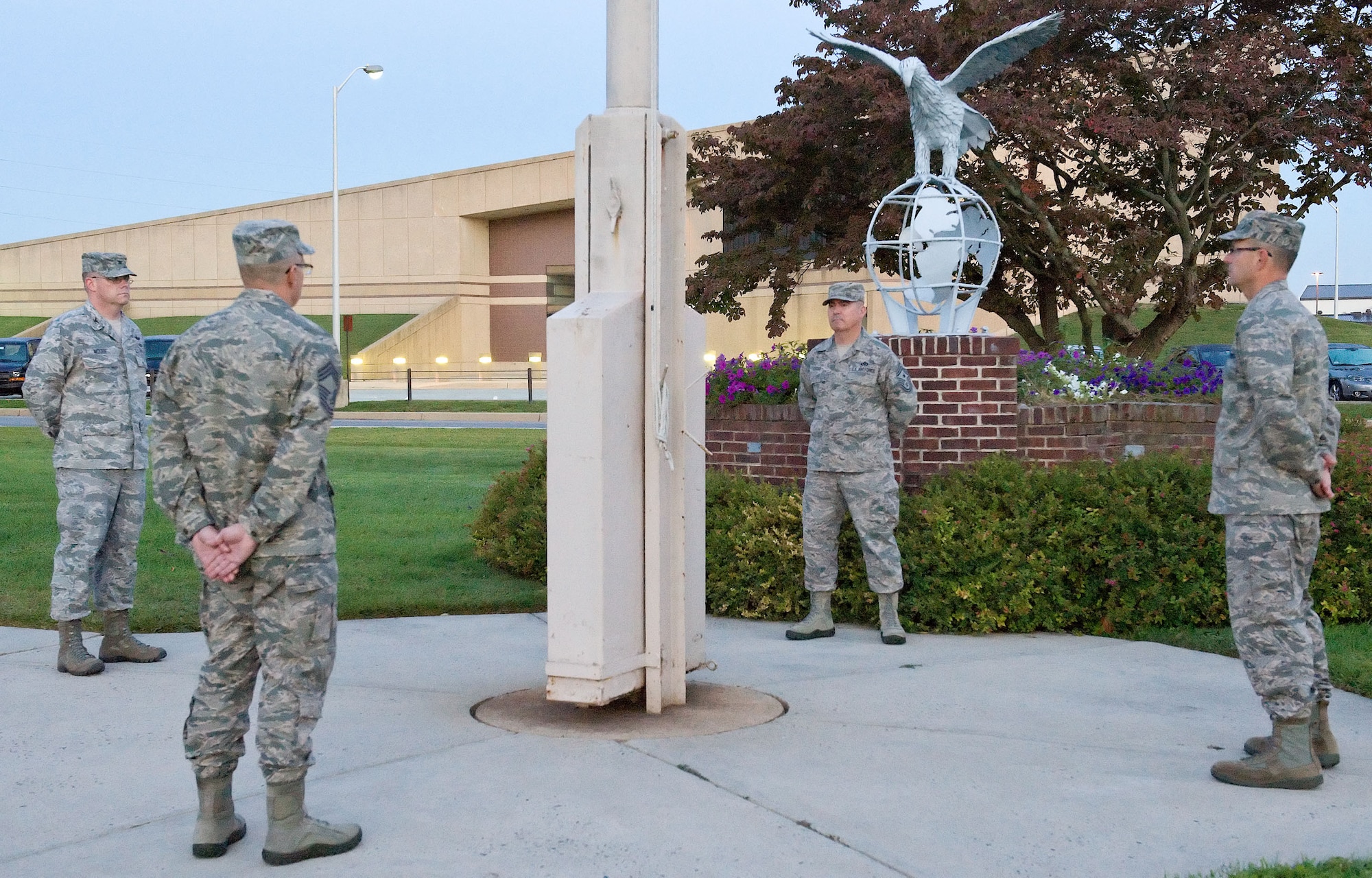 Senior leadership from the 512th and 436th Airlift Wings participate in an around-the-clock vigil Sept. 21, 2012, at the base flag pole in honor of POW/MIA Recognition Day. It's one of six days specified by law on which the black POW/MIA flag shall be flown over federal facilities and cemeteries, post offices and military installations. Pictured from left to right are Col. Richard G. Moore Jr., 436th AW commander; Chief Master Sgt. Matthew Sirkis, 512th Maintenance Group chief enlisted adviser; Chief Master Sgt. James B. Lucas, 436th AW command chief; and Col. Raymond A. Kozak, 512th AW commander. (U.S. Air Force photo by Roland Balik)
