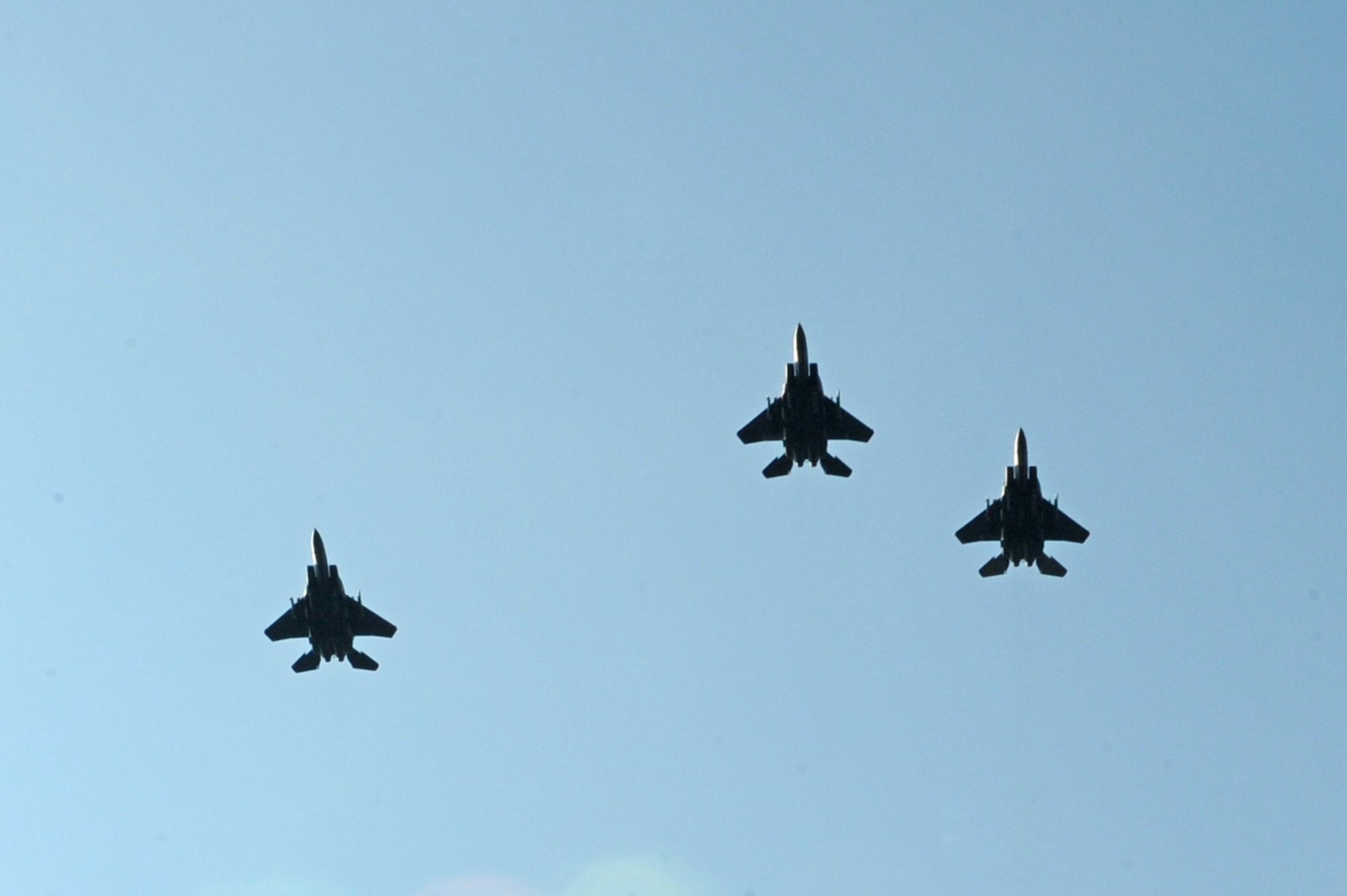 F-15E Strike Eagles fly the “Missing Man” formation during the POW/MIA Remembrance Ceremony on Seymour Johnson Air Force Base, N.C., Sept. 21, 2012. National POW/MIA Recognition Day is one of six days specified by federal law that the POW/MIA flag will be flown over cemeteries, federal facilities and military installations.  (U.S. Air Force photo/Airman 1st Class John Nieves Camacho/Released)