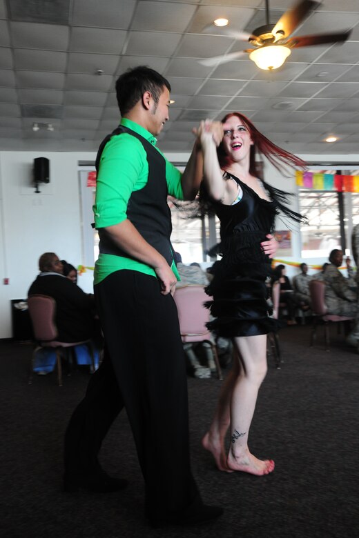 Myat Nyunt and Samantha Fries of Arthur Murray Dance studio demonstrate salsa, merengue, bachata and rumba dances during a Hispanic Heritage Month celebration held at the Community Activity Center from 11:30 a.m. to 1 p.m., Sept. 21, 2012. The event included a free ethnic-food tasting, a professional dancing demonstration, a live DJ and an opportunity for Joint Base Andrews patrons to dance. (U.S. Air Force photo/ Senior Airman Amber Russell) 