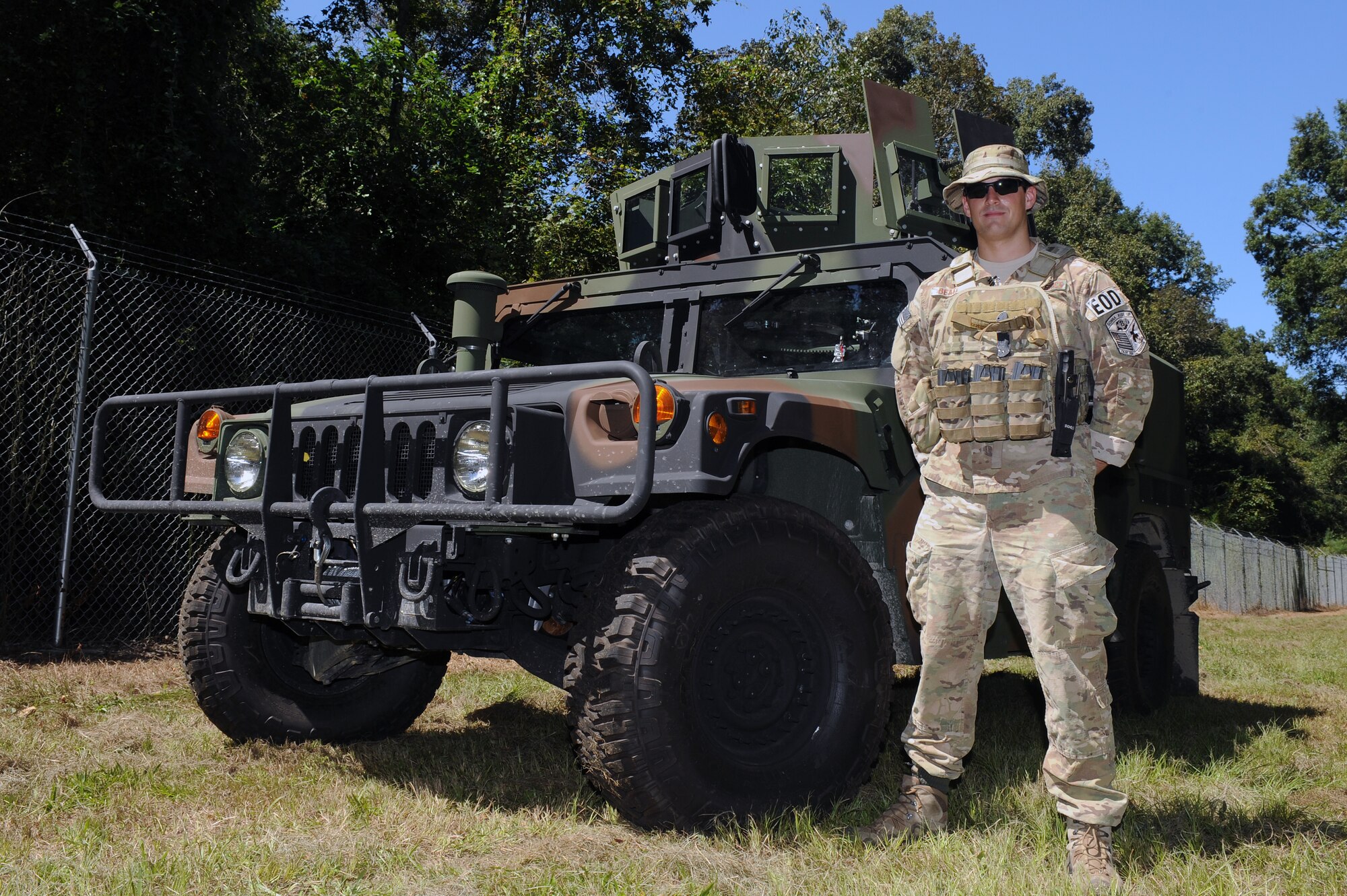 U.S. Air Force Senior Airman Justin Beasley, 4th Civil Engineer Squadron Explosive Ordnance Disposal journeyman, stands beside an armored humvee at the EOD range on Seymour Johnson Air Force Base, N.C., Sept. 12, 2012. Beasley earned the United Service Organizations of North Carolina Spirit of Freedom Award for 2012. (U.S. Air Force photo/Airman 1st Class John Nieves Camacho/Released)