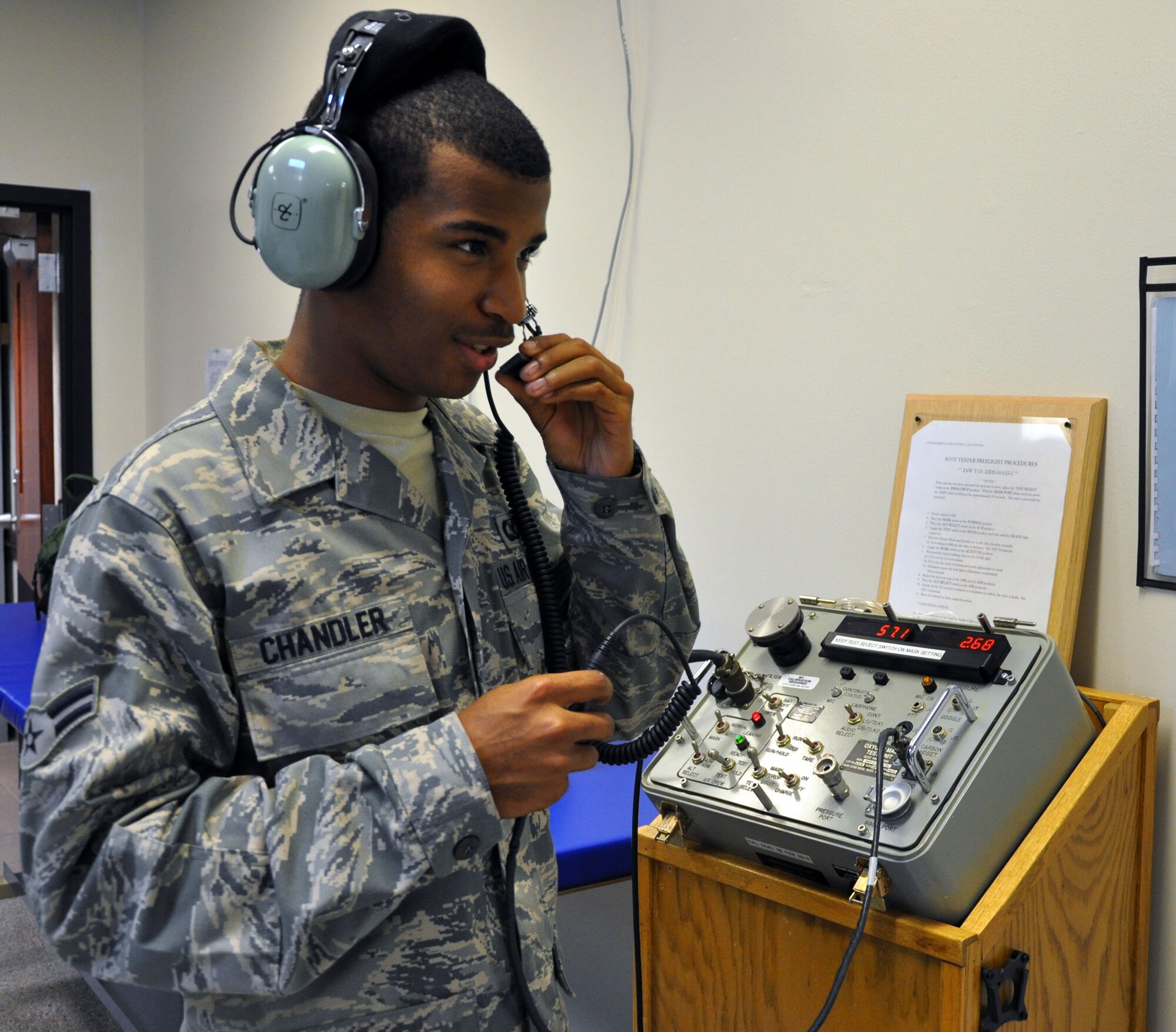 Airman 1st Class Mitchell Chandler, an aircrew flight equipment technician assigned to the Air Force Reserve 931st Operations Support Squadron, McConnell Air Force Base, Kan., uses a Scott tester to check the functionality of an aviation headset, Sept. 25, 2012.  Aircrew flight equipment technicians conduct tests on the earphones and communication microphones on the headsets to ensure they are in proper working order for aircrews.  (U.S. Air Force photo by 1st Lt. Zach Anderson)