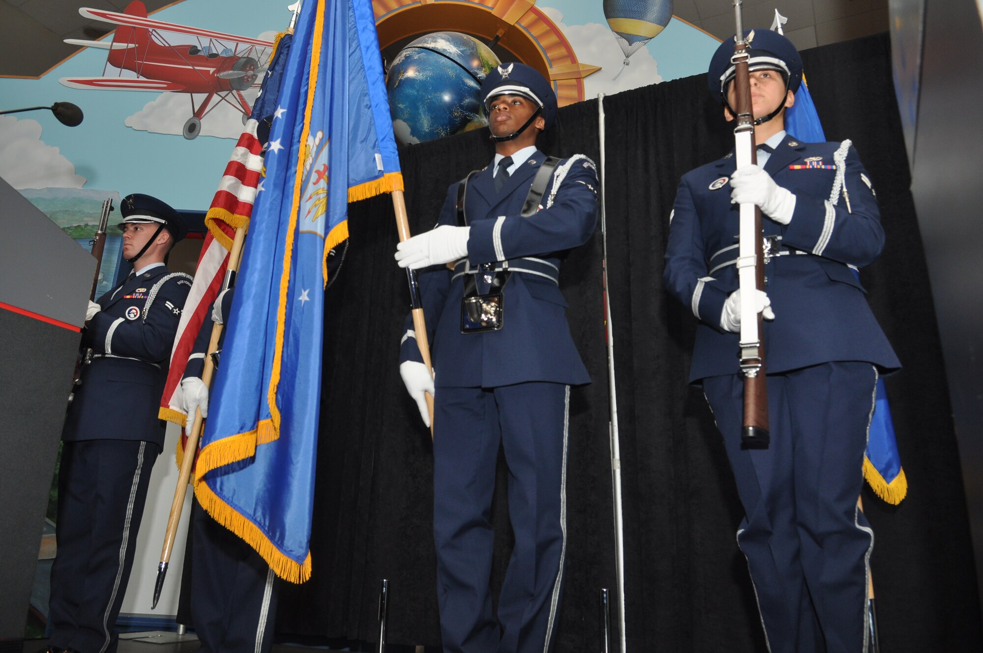 Members of the McChord Field Honor Guard present the colors during the opening ceremony at the McChord Field 2012 AF Ball, Sept. 21, 2012 at The Museum of Flight, Boeing Field, Seattle, Wash.The evenings events included musical entertainment by the U.S. Air Force Band of the Golden West, a performance by the Air Force Honor Guard Drill Team, a tour of the museum and a speech from guest speaker, retired Lt. Gen. Rusty Findley, Air Mobility Command vice commander. (U.S. Air Force photo/Staff Sgt. Sean Tobin)