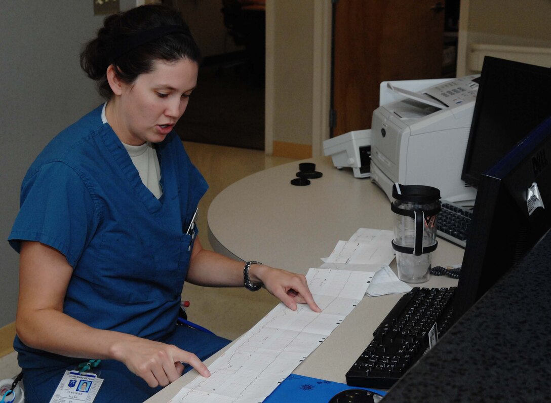 2nd Lt. Melissa Poole, 633rd Medical Group clinical nurse, and first in the Air Force Marathon overall military female category, analyzes an unborn child’s vitals, Sept. 25 at Langley Air Force Base. Poole runs marathons and other events to relieve the stress that often comes with taking care of newborn infants at the U.S. Air Force Hospital Langley maternity ward. (U.S. Air Force photo by Airman 1st Class Austin Harvill/Released)