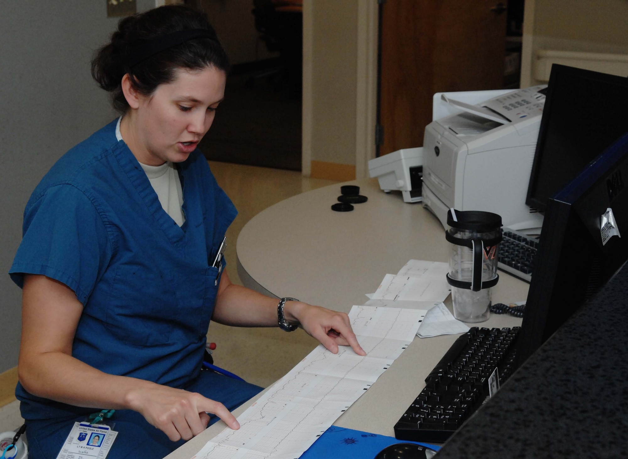 2nd Lt. Melissa Poole, 633rd Medical Group clinical nurse, and first in the Air Force Marathon overall military female category, analyzes an unborn child’s vitals, Sept. 25 at Langley Air Force Base. Poole runs marathons and other events to relieve the stress that often comes with taking care of newborn infants at the U.S. Air Force Hospital Langley maternity ward. (U.S. Air Force photo by Airman 1st Class Austin Harvill/Released)